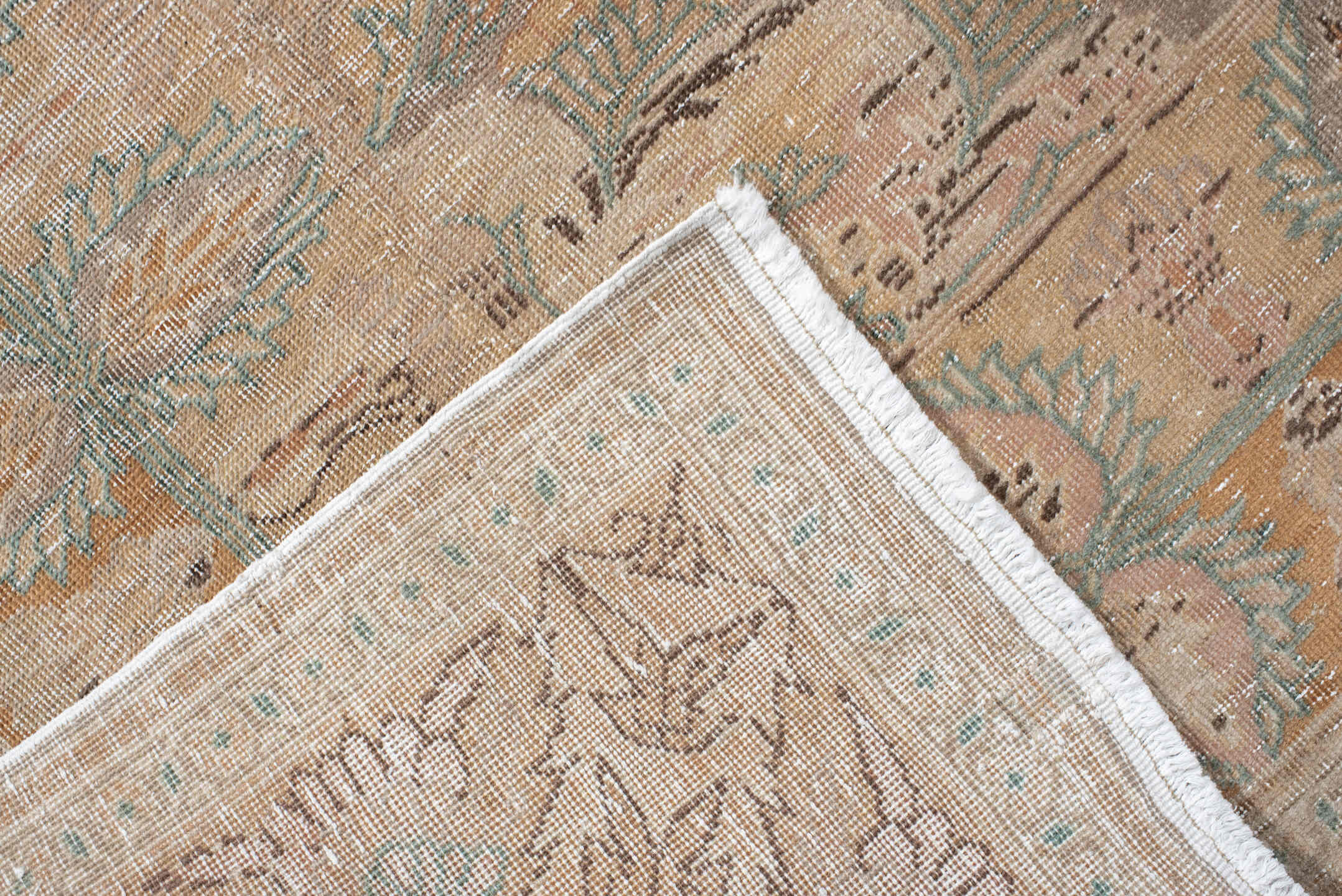 5' x 7' one-of-a-kind handmade antique Hereke rug. Color palette: blush, ivory, celadon, peach, coral, taupe, sage, brown