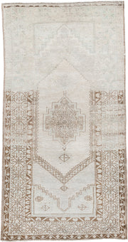 3' x 6' one-of-a-kind handmade antique Anatolian rug. Color palette: ivory, taupe, beige, camel, sand, light brown, gray