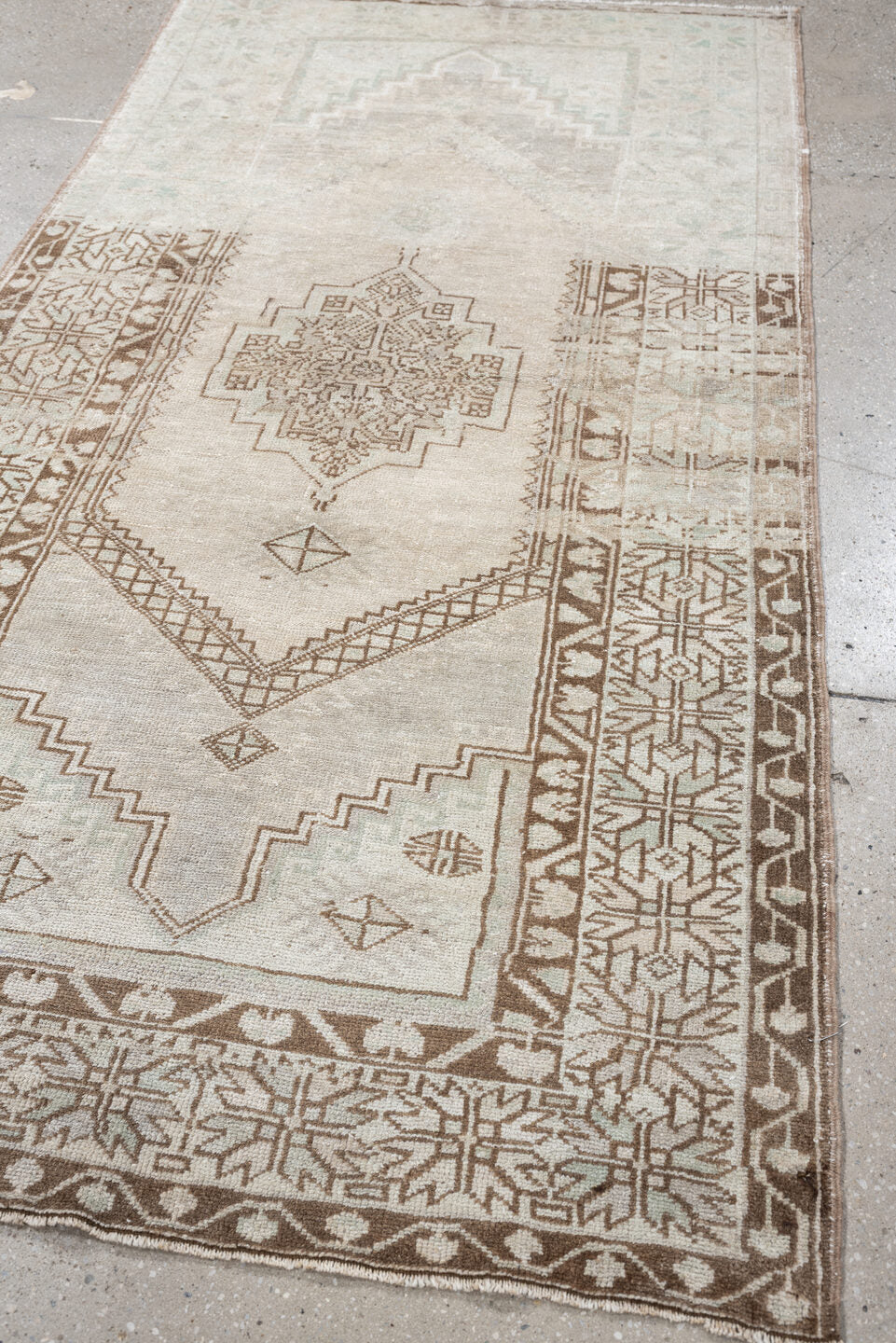 3' x 6' one-of-a-kind handmade antique Anatolian rug. Color palette: ivory, taupe, beige, camel, sand, light brown, gray
