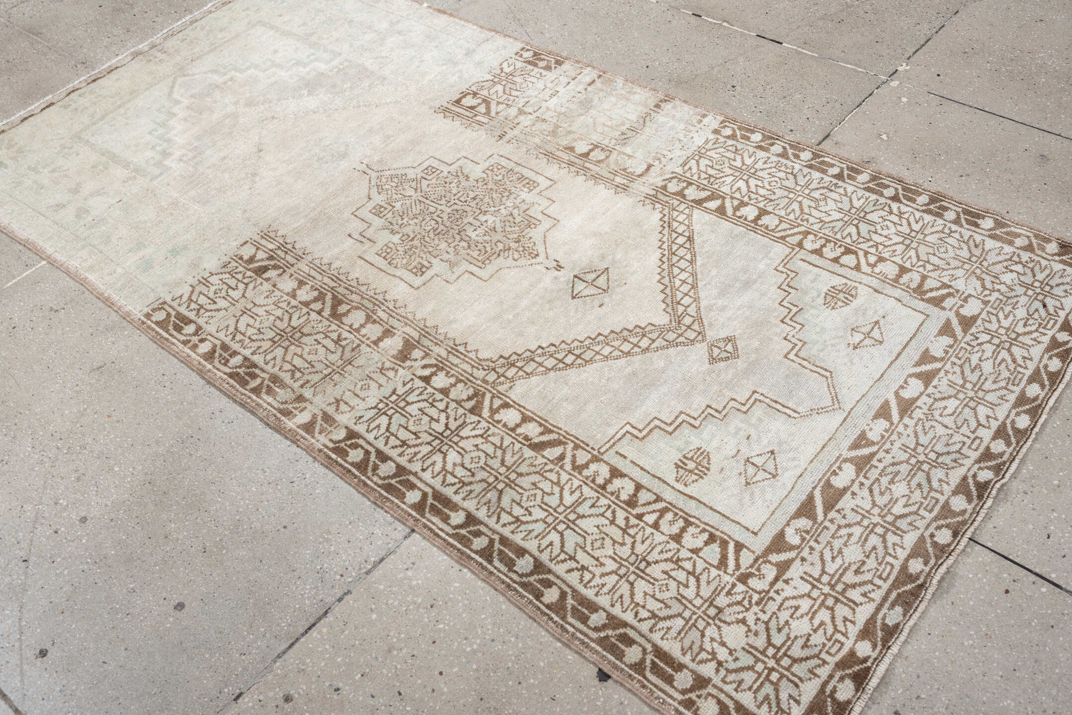 3' x 6' one-of-a-kind handmade antique Anatolian rug. Color palette: ivory, taupe, beige, camel, sand, light brown, gray