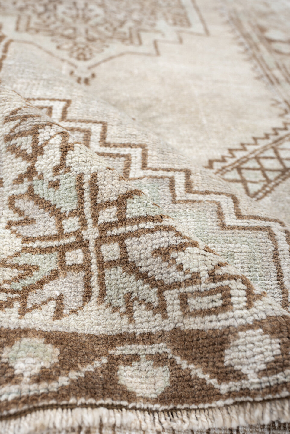 3' x 6' one-of-a-kind handmade antique Anatolian rug. Color palette: ivory, taupe, beige, camel, sand, light brown, gray