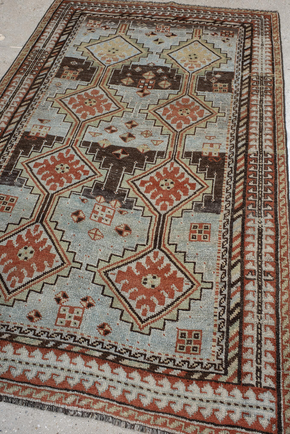 4' x 6' one-of-a-kind handmade vintage Gabbe rug. Color palette: ivory, rust, brown, charcoal, camel, pale blue, terracotta