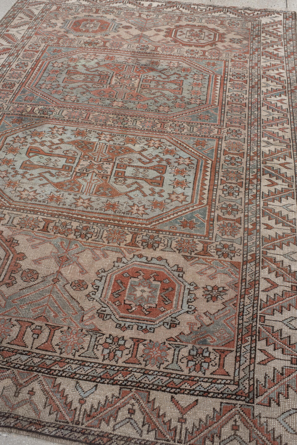 5' x 7' one-of-a-kind handmade antique Anatolian rug. Color palette: ivory, rust, blue_gray, charcoal, terracotta, taupe