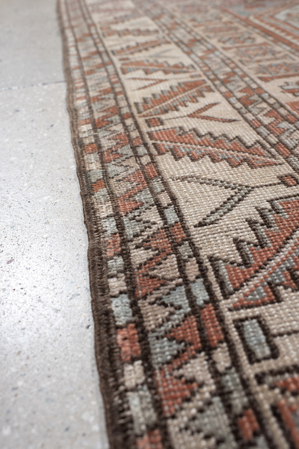 5' x 7' one-of-a-kind handmade antique Anatolian rug. Color palette: ivory, rust, blue_gray, charcoal, terracotta, taupe