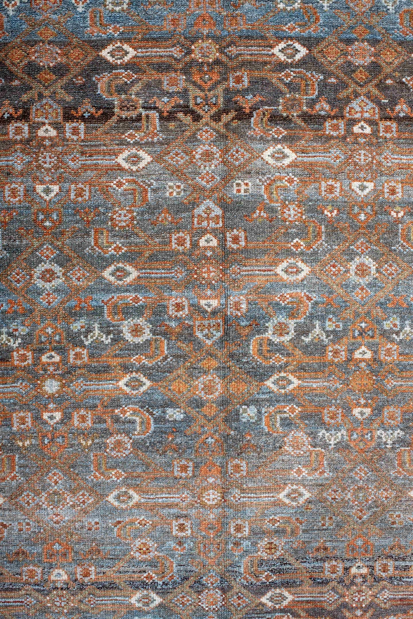 4' x 7' one-of-a-kind handmade antique Malayer rug. Color palette: rust, blue, ivory, slate, charcoal, taupe, camel