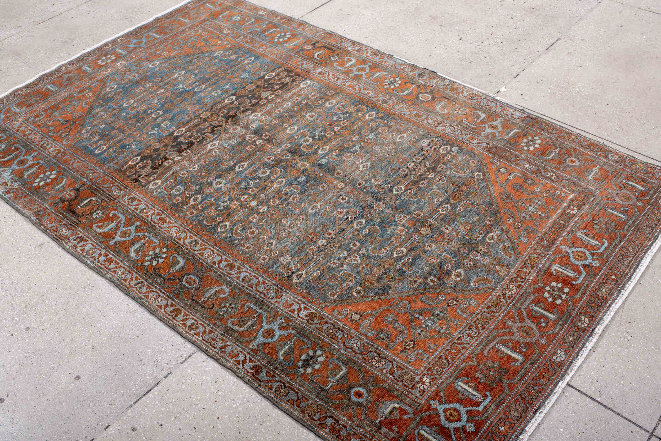4' x 7' one-of-a-kind handmade antique Malayer rug. Color palette: rust, blue, ivory, slate, charcoal, taupe, camel