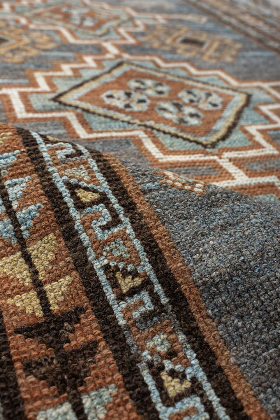 3' x 7' one-of-a-kind handmade antique Gabbe rug. Color palette: blue, rust, ivory, brown, camel, teal, charcoal, terracotta