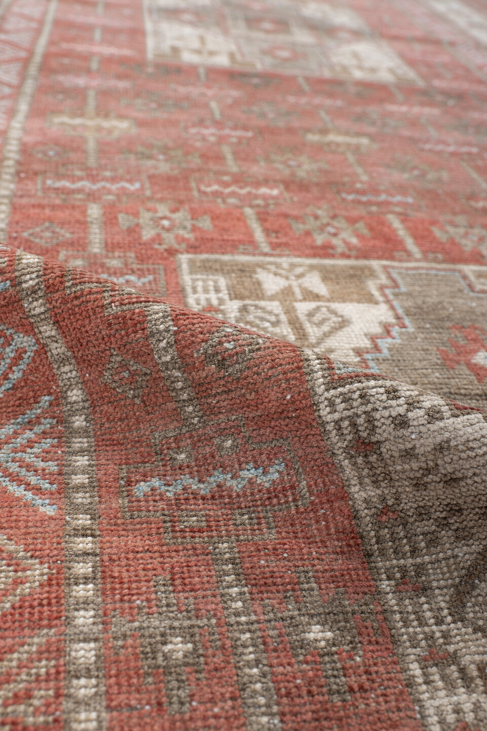 3' x 7' one-of-a-kind handmade antique Belouch runner rug. Color palette: terra cotta, ivory, taupe, brown, slate, rust