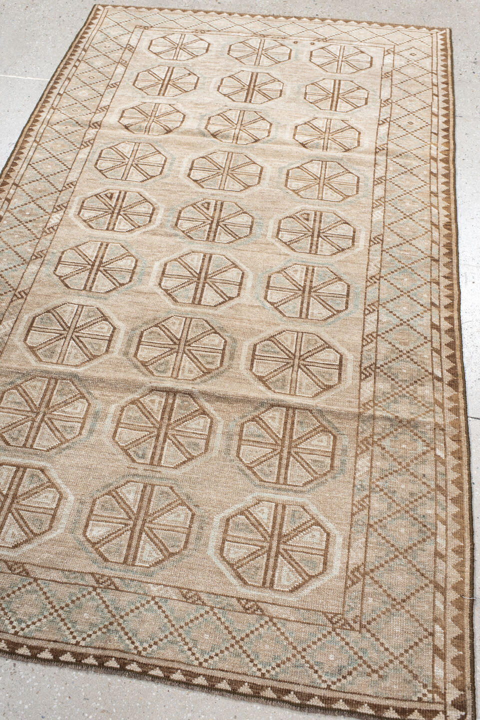 3' x 6' one-of-a-kind handmade antique Belouch rug. Color palette: ivory, camel, taupe, brown, pale blue, beige, gray
