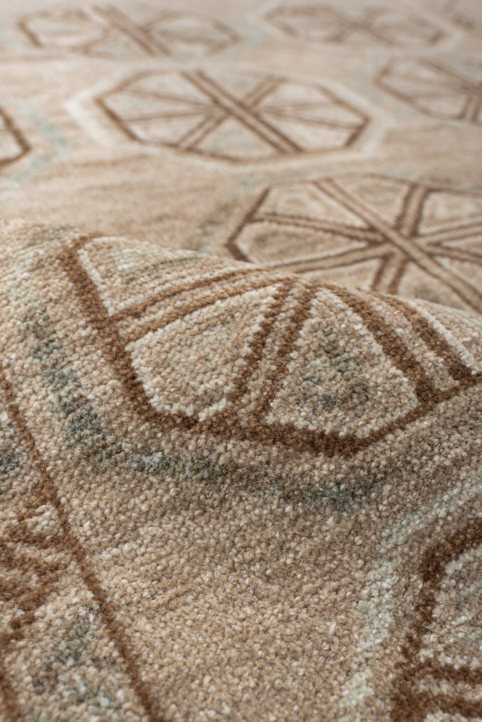 3' x 6' one-of-a-kind handmade antique Belouch rug. Color palette: ivory, camel, taupe, brown, pale blue, beige, gray
