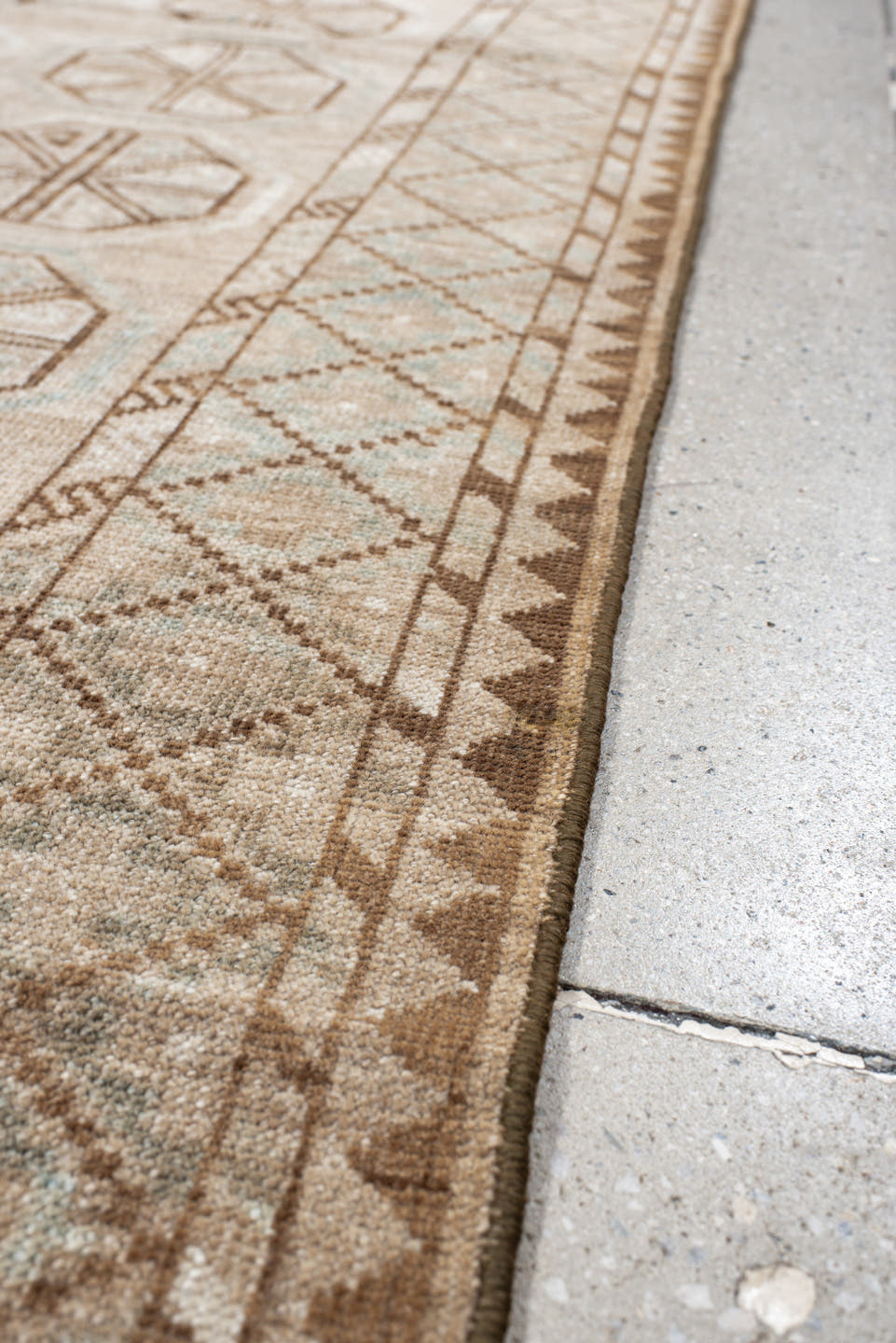 3' x 6' one-of-a-kind handmade antique Belouch rug. Color palette: ivory, camel, taupe, brown, pale blue, beige, gray