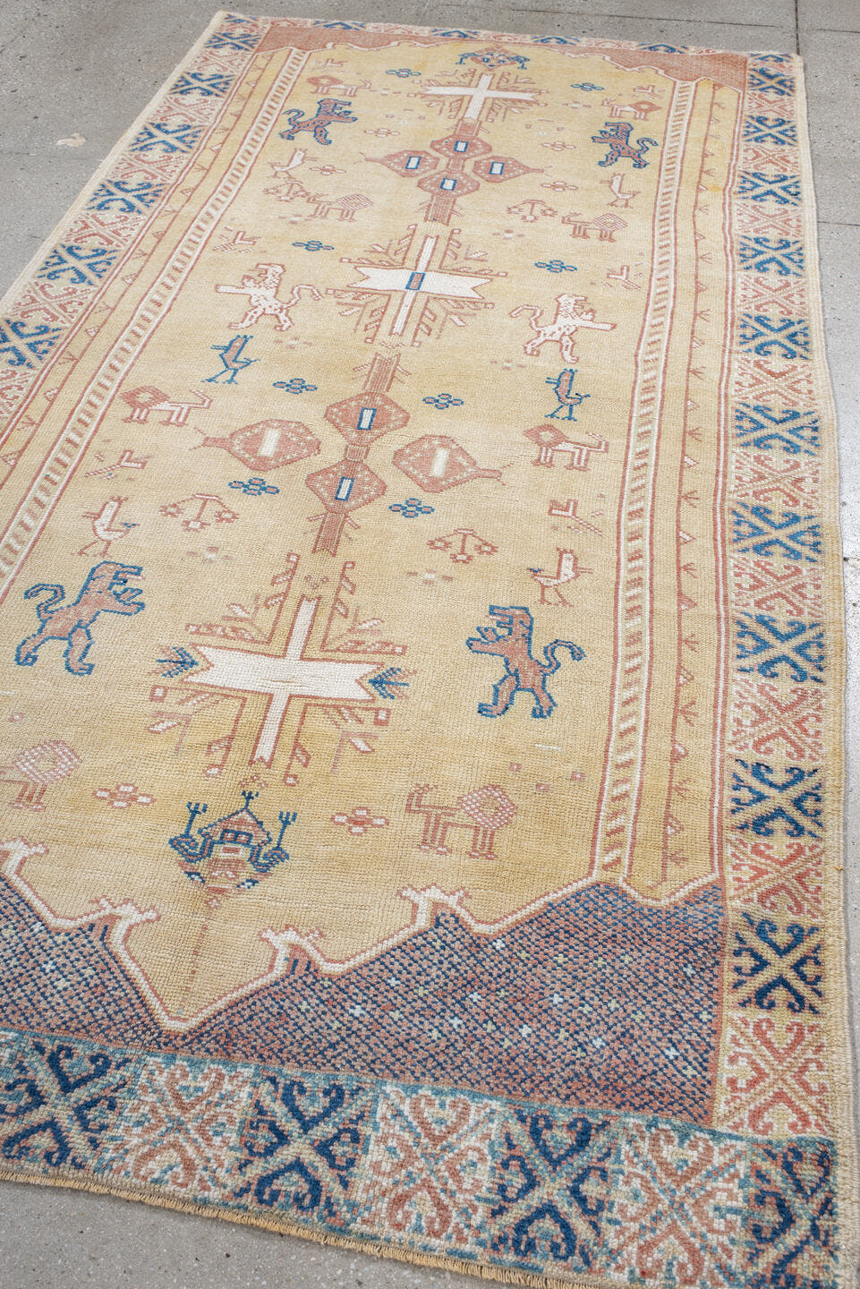 4' x 9' one-of-a-kind handmade antique Moroccan rug. Color palette: ivory, rose, blue, navy, cream, taupe, pink, red, beige