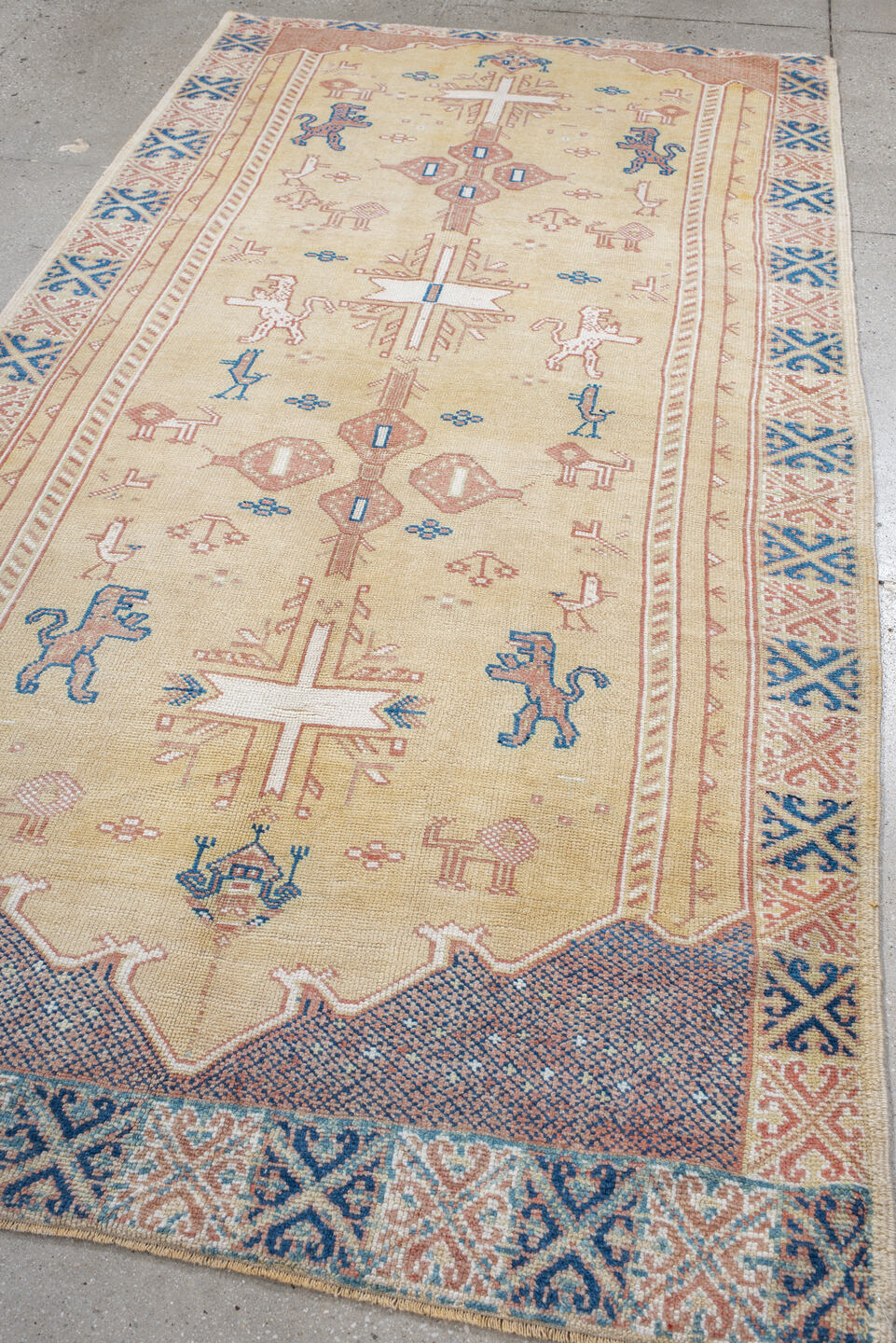 4' x 9' one-of-a-kind handmade antique Moroccan rug. Color palette: ivory, rose, blue, navy, cream, taupe, pink, red, beige