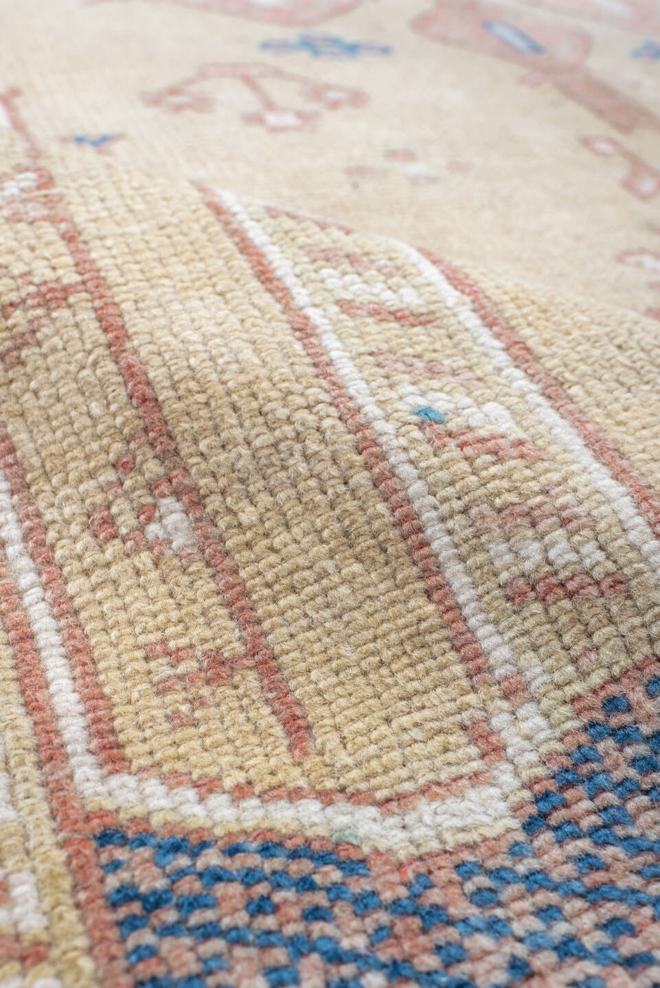 4' x 9' one-of-a-kind handmade antique Moroccan rug. Color palette: ivory, rose, blue, navy, cream, taupe, pink, red, beige