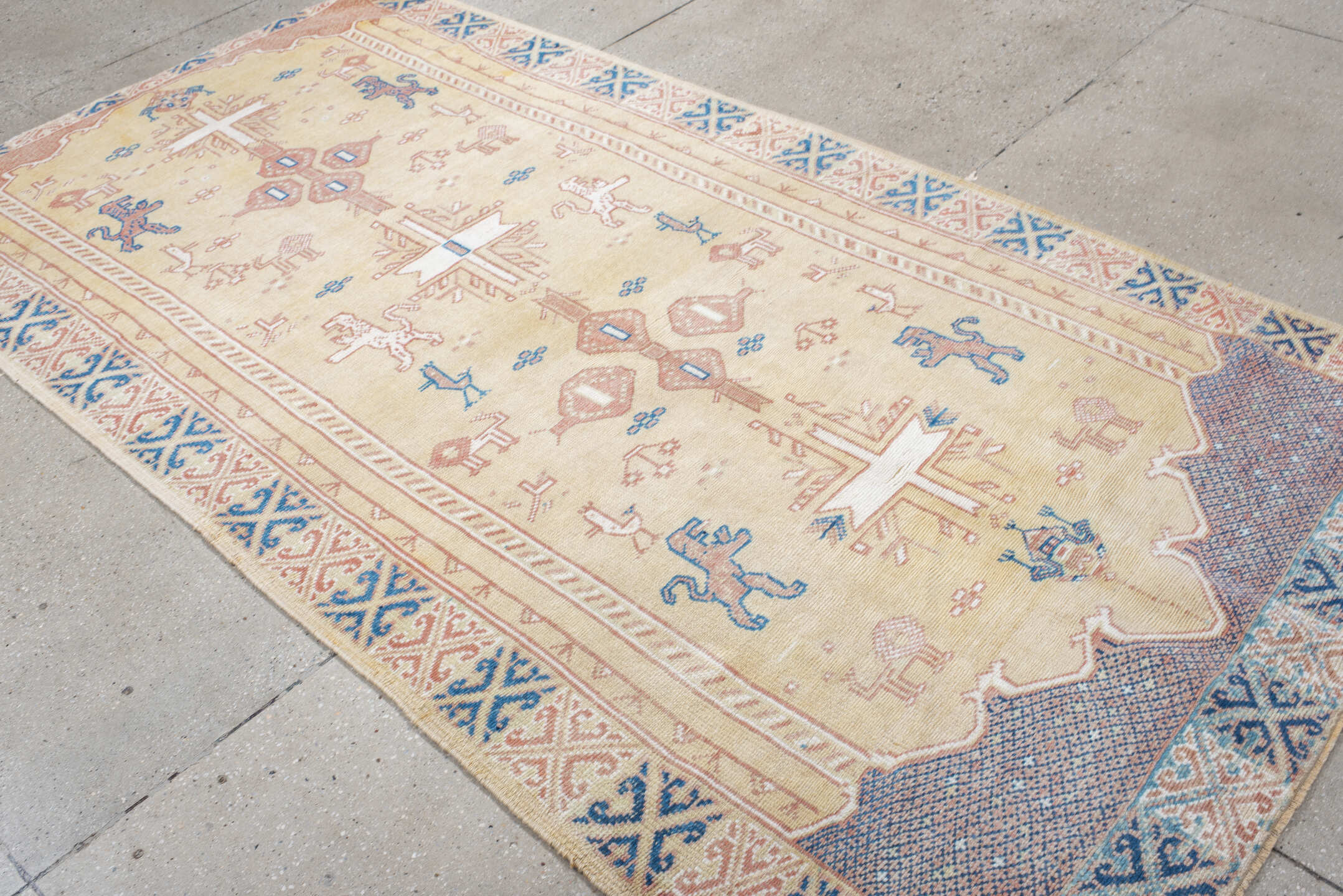 4' x 9' one-of-a-kind handmade antique Moroccan rug. Color palette: ivory, rose, blue, navy, cream, taupe, pink, red, beige