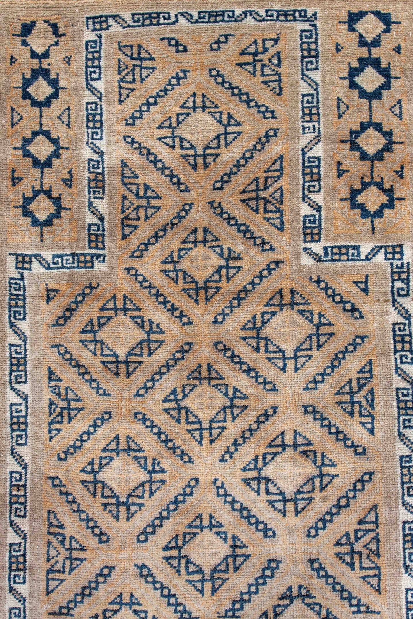 3' x 5' one-of-a-kind handmade antique Belouch small size rug. Color palette: camel, indigo, ivory, taupe, sand, beige