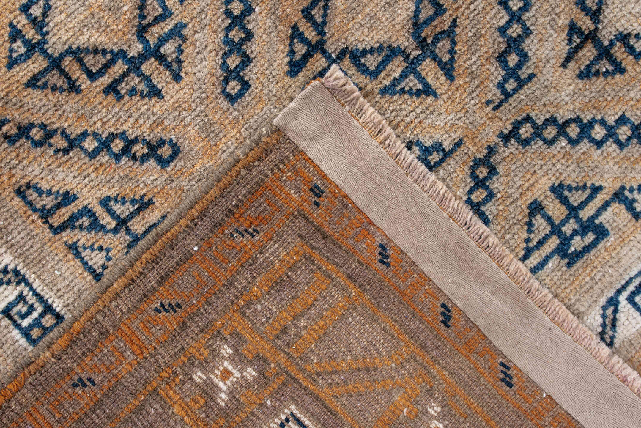 3' x 5' one-of-a-kind handmade antique Belouch small size rug. Color palette: camel, indigo, ivory, taupe, sand, beige