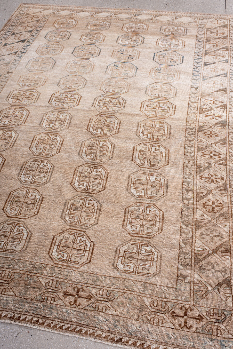 5' x 7' one-of-a-kind handmade antique Afghan rug. Color palette: ivory, taupe, camel, sand, brown, slate, beige, gray