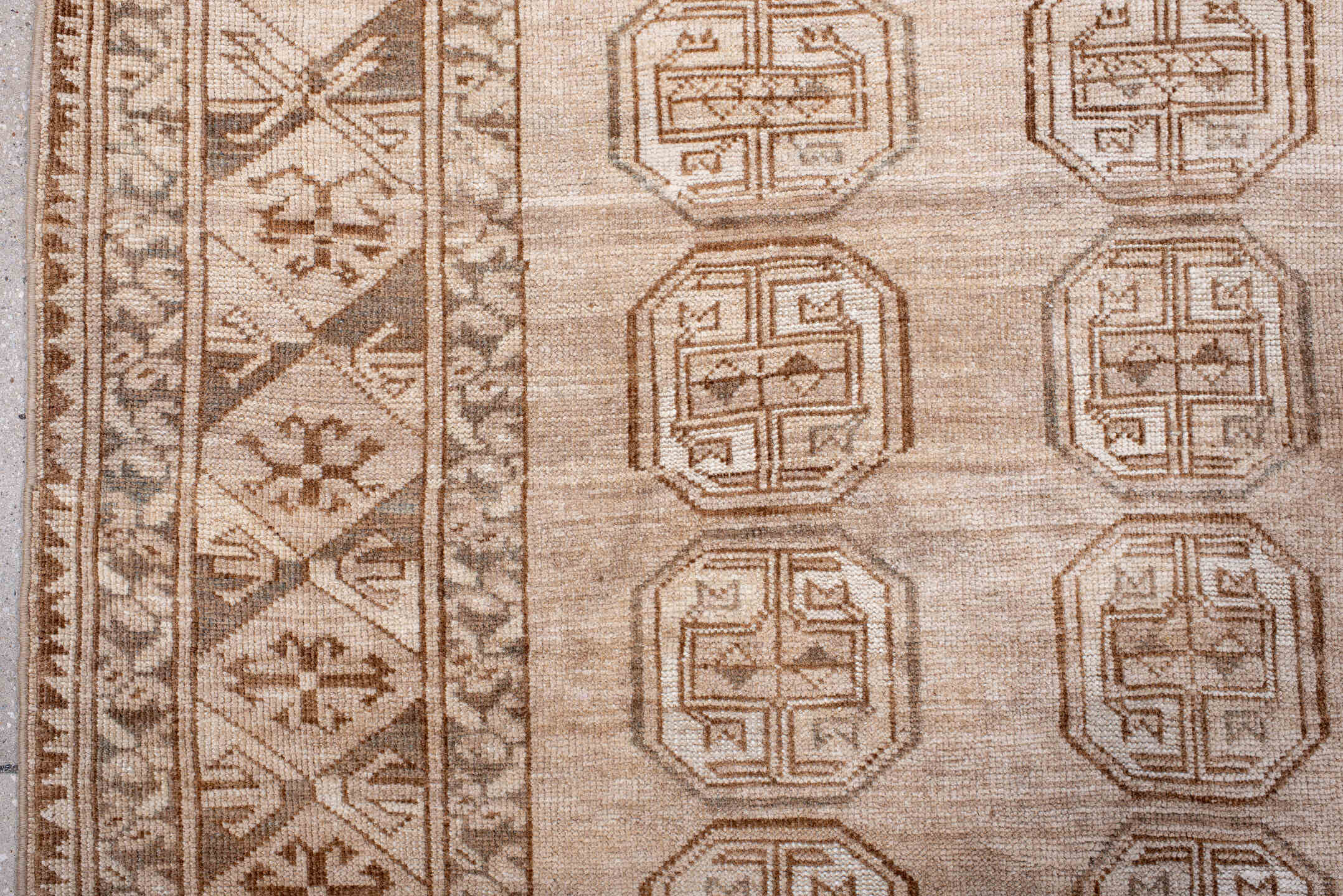 5' x 7' one-of-a-kind handmade antique Afghan rug. Color palette: ivory, taupe, camel, sand, brown, slate, beige, gray