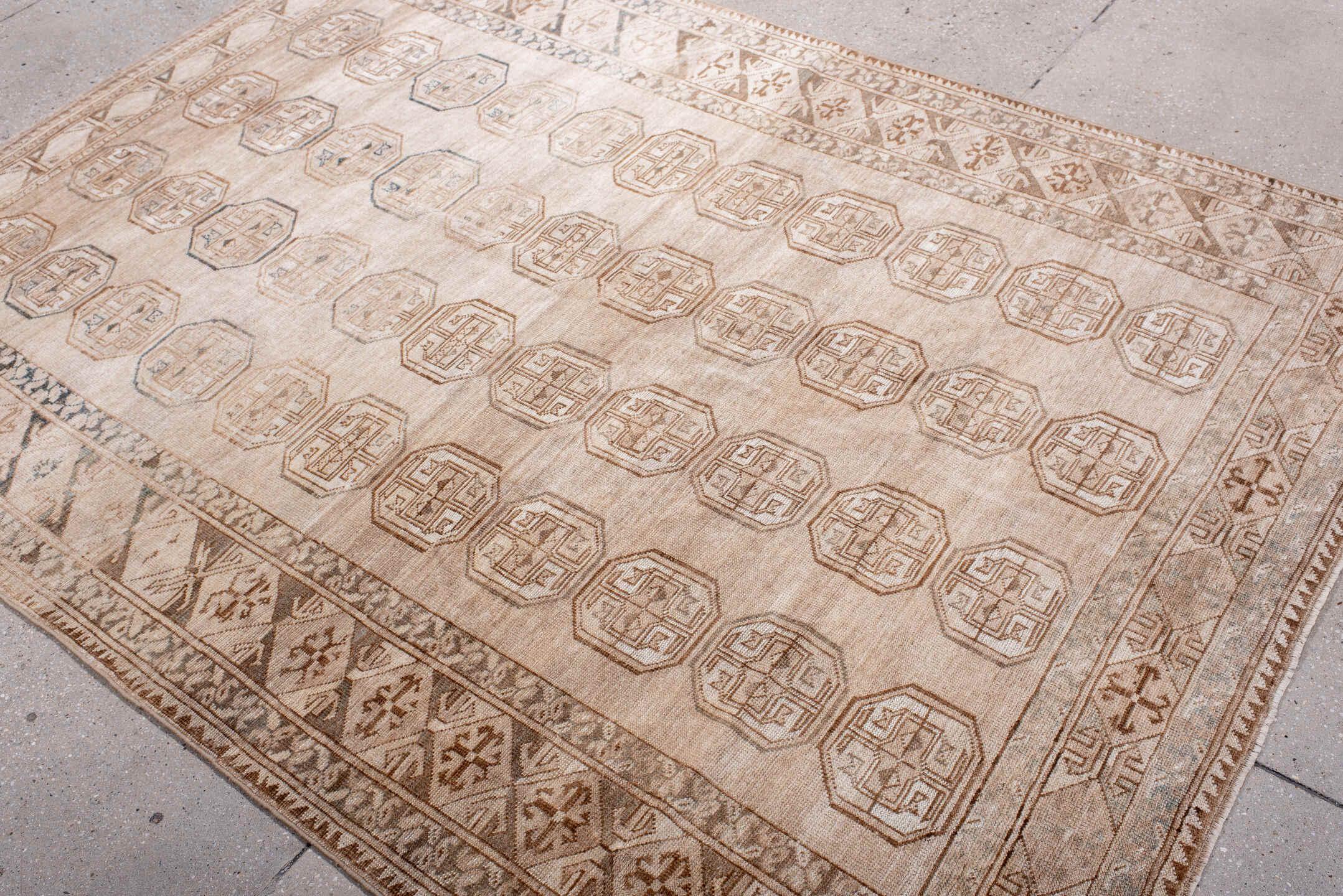 5' x 7' one-of-a-kind handmade antique Afghan rug. Color palette: ivory, taupe, camel, sand, brown, slate, beige, gray