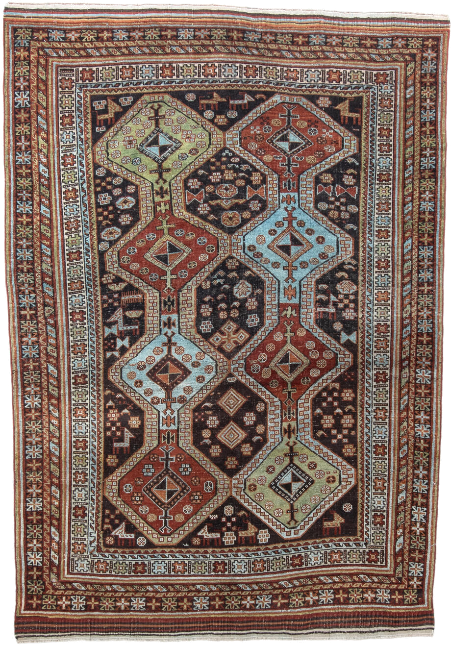4' x 6' one-of-a-kind handmade antique Belouch small size rug. Color palette: rust, ivory, dark brown, sky blue, sage