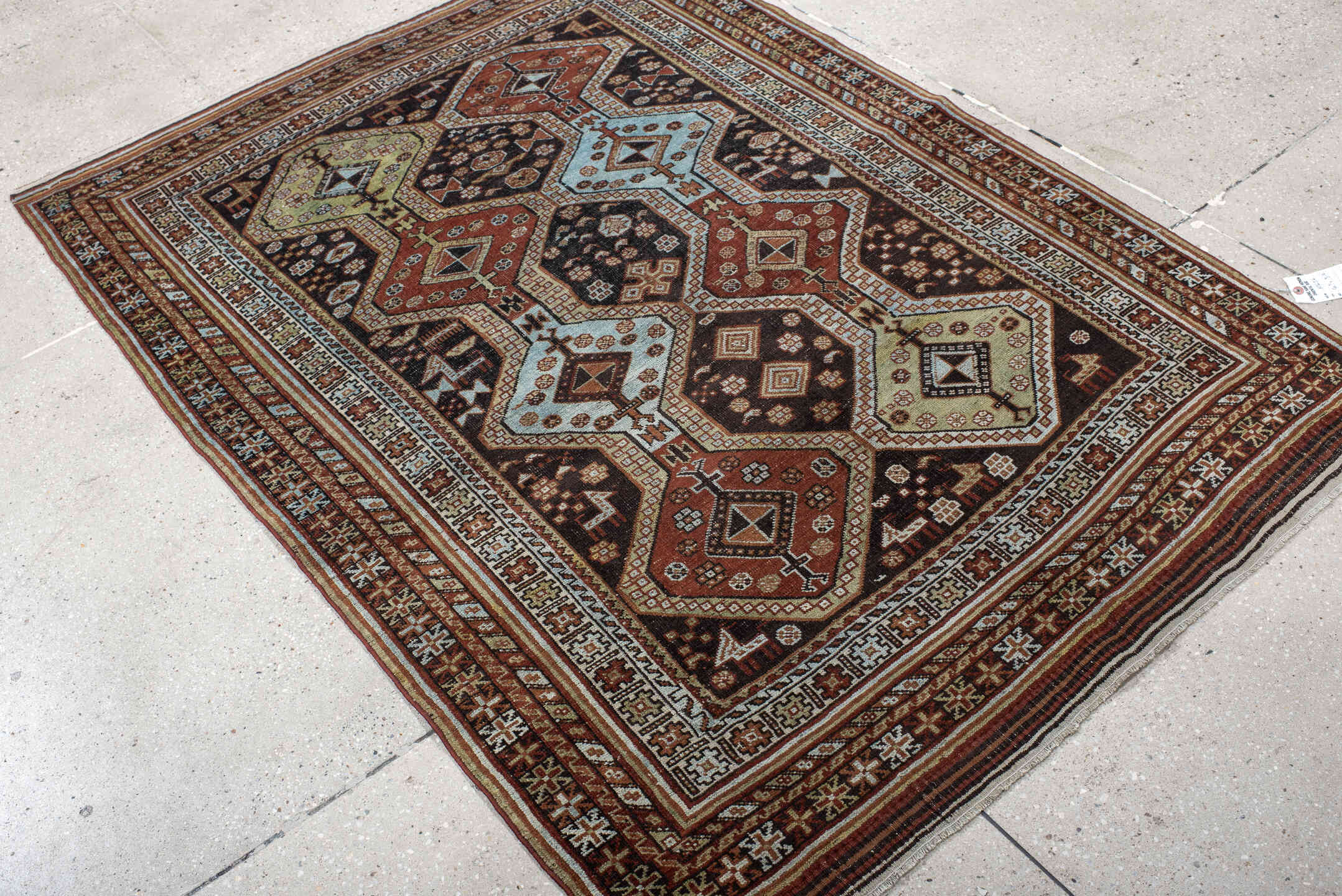 4' x 6' one-of-a-kind handmade antique Belouch small size rug. Color palette: rust, ivory, dark brown, sky blue, sage