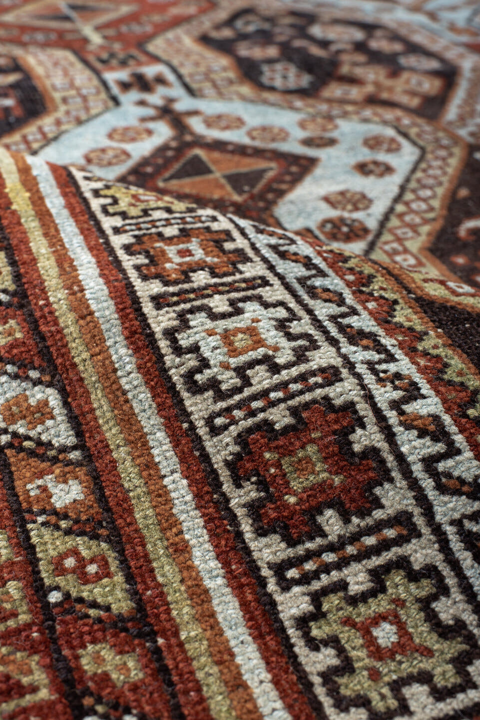 4' x 6' one-of-a-kind handmade antique Belouch small size rug. Color palette: rust, ivory, dark brown, sky blue, sage
