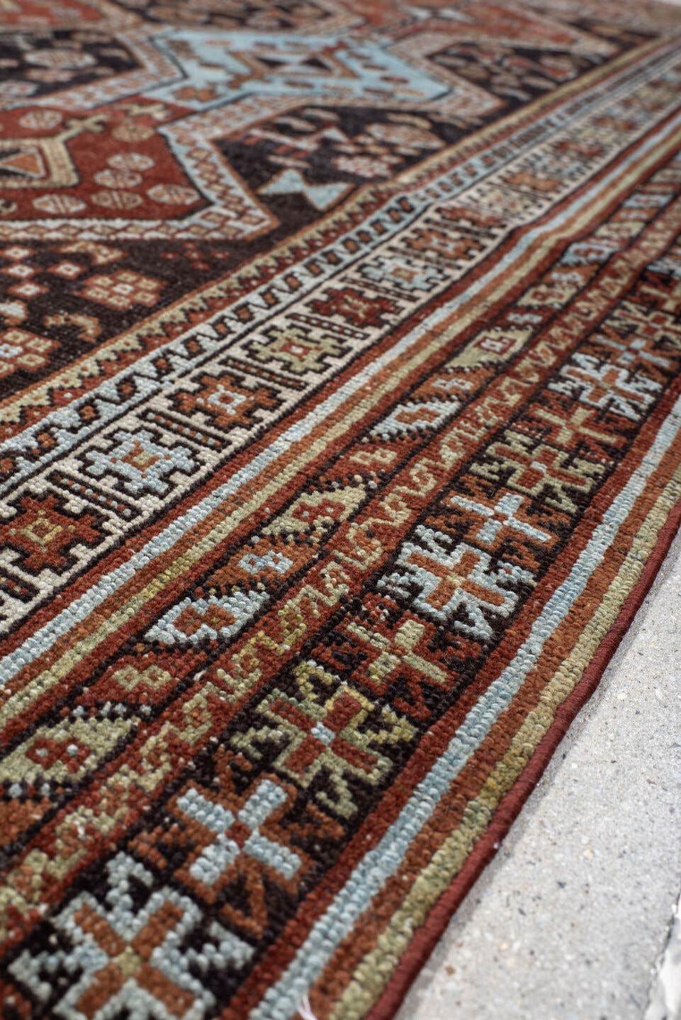 4' x 6' one-of-a-kind handmade antique Belouch small size rug. Color palette: rust, ivory, dark brown, sky blue, sage
