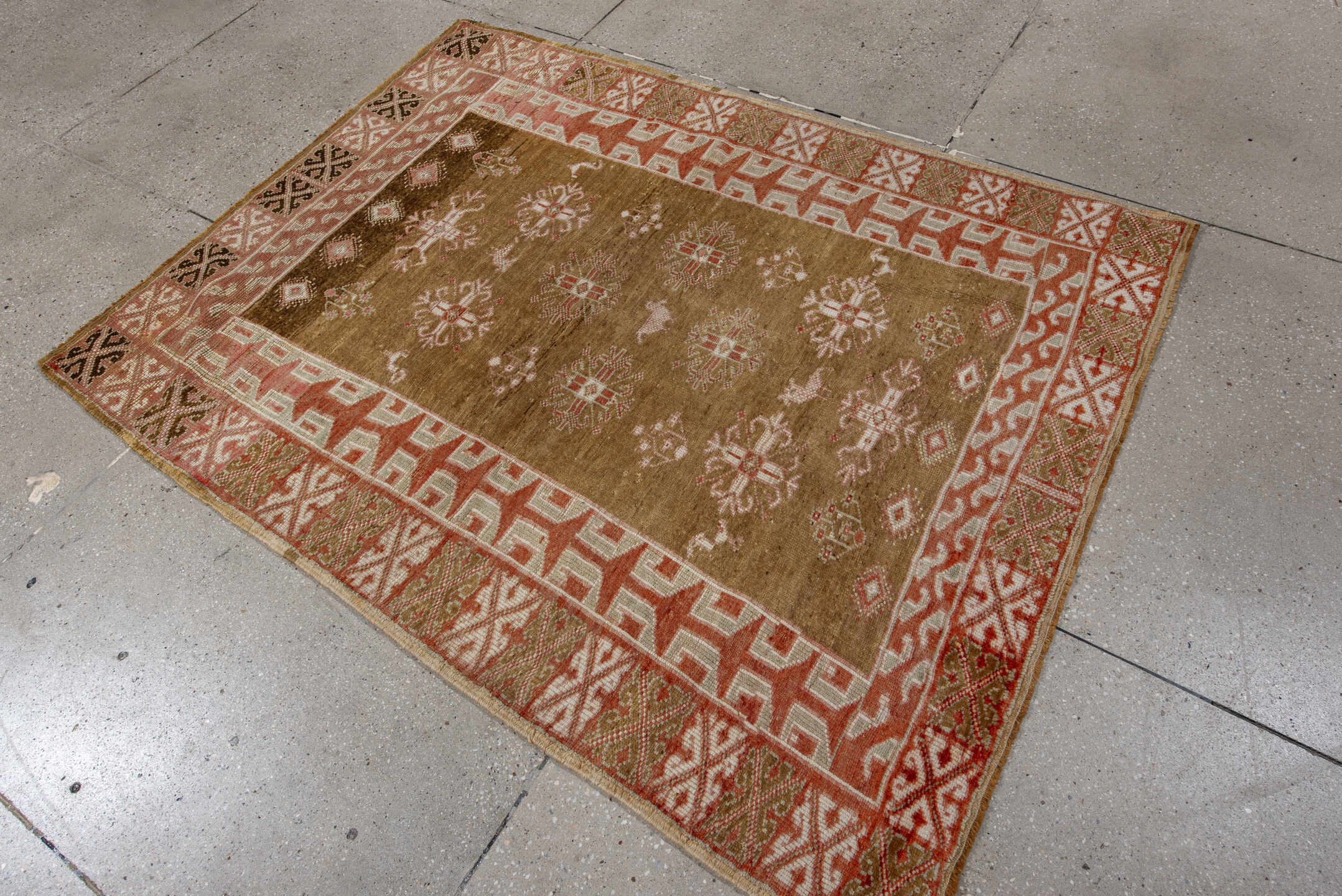 4' x 6' one-of-a-kind handmade antique Anatolian rug. Color palette: camel, ivory, terra cotta, olive, brown, rose, beige