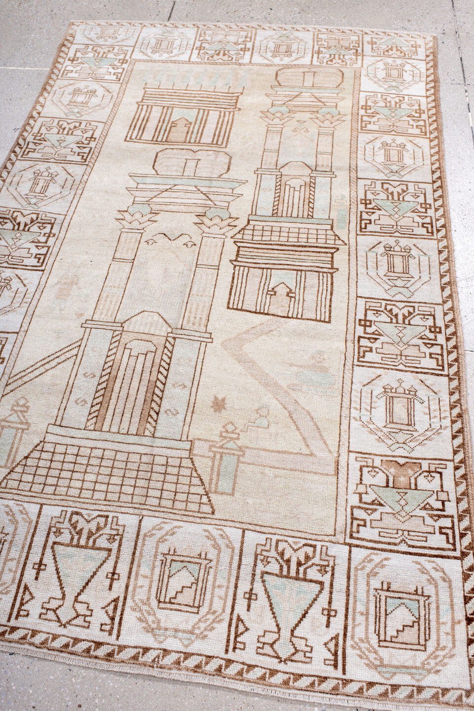 3' x 6' one-of-a-kind handmade antique Belouch small size rug. Color palette: ivory, camel, taupe, pale celadon, cream