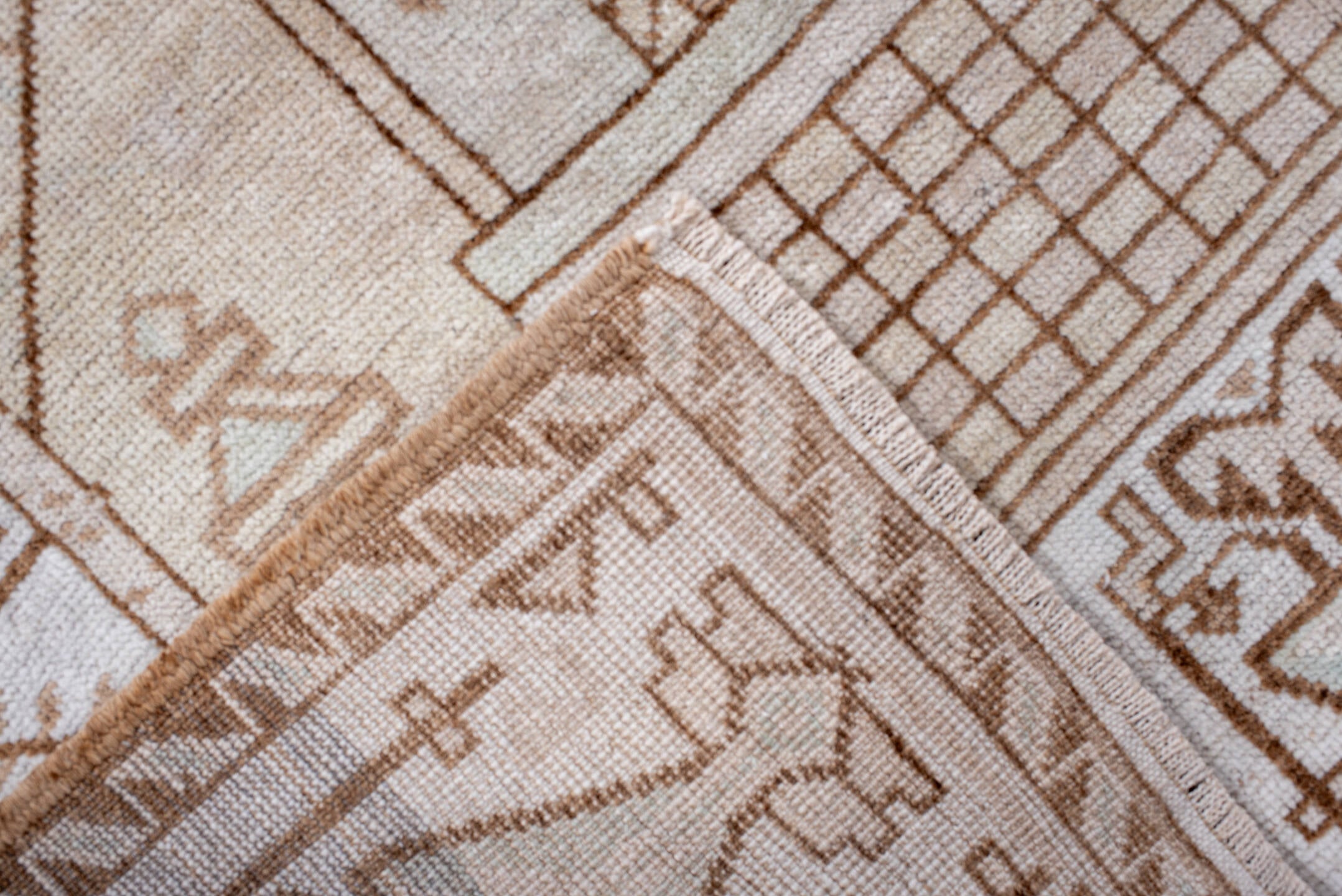 3' x 6' one-of-a-kind handmade antique Belouch small size rug. Color palette: ivory, camel, taupe, pale celadon, cream