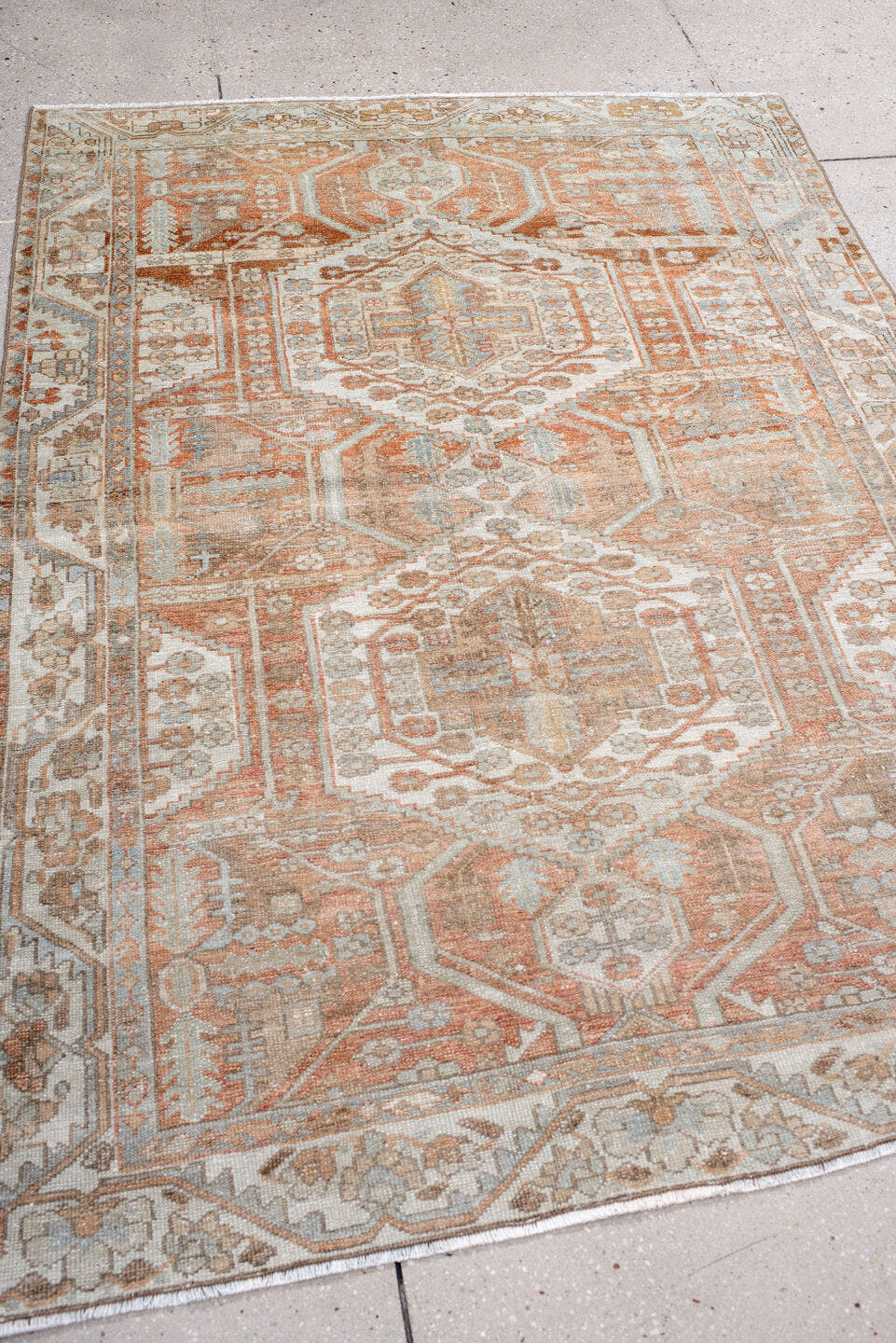 4' x 6' one-of-a-kind handmade antique Baktiary rug. Color palette: ivory, camel, rust, taupe, pale blue, terra cotta, beige