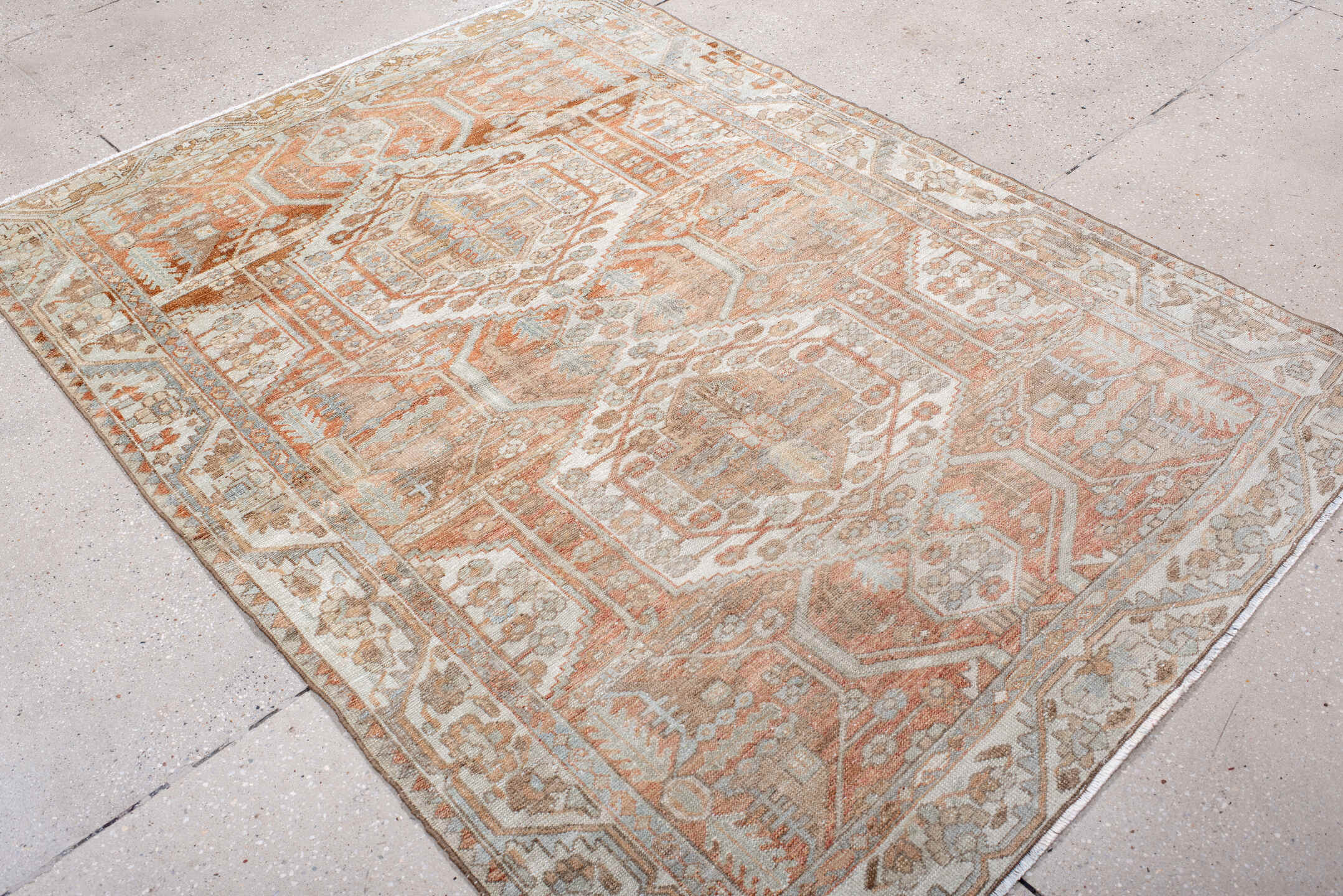 4' x 6' one-of-a-kind handmade antique Baktiary rug. Color palette: ivory, camel, rust, taupe, pale blue, terra cotta, beige