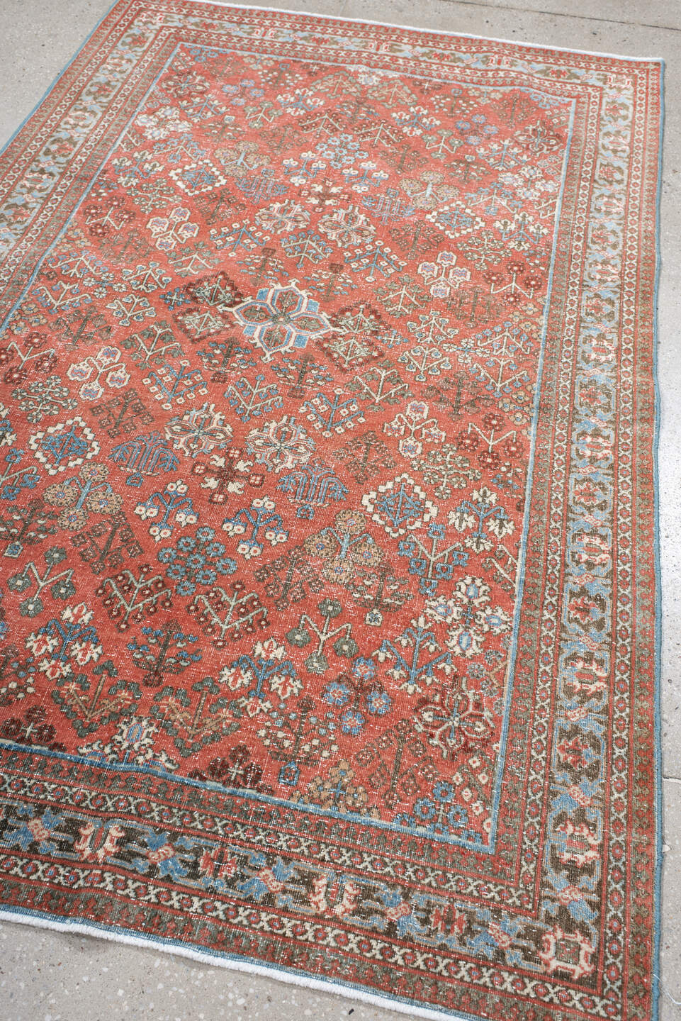 4' x 6' one-of-a-kind handmade vintage Joshegan rug. Color palette: terracotta, pale blue, ivory, slate, taupe, rust