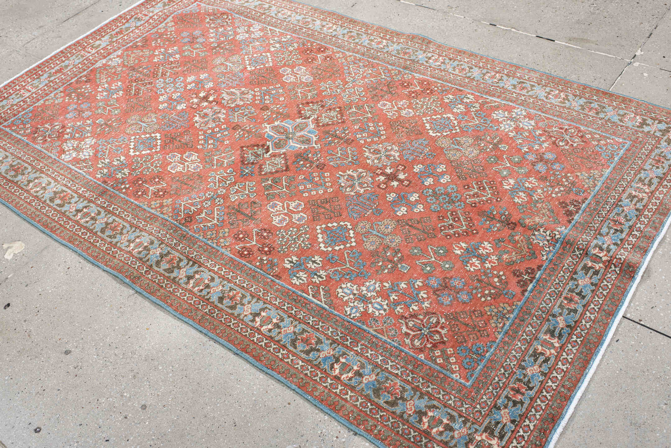 4' x 6' one-of-a-kind handmade vintage Joshegan rug. Color palette: terracotta, pale blue, ivory, slate, taupe, rust