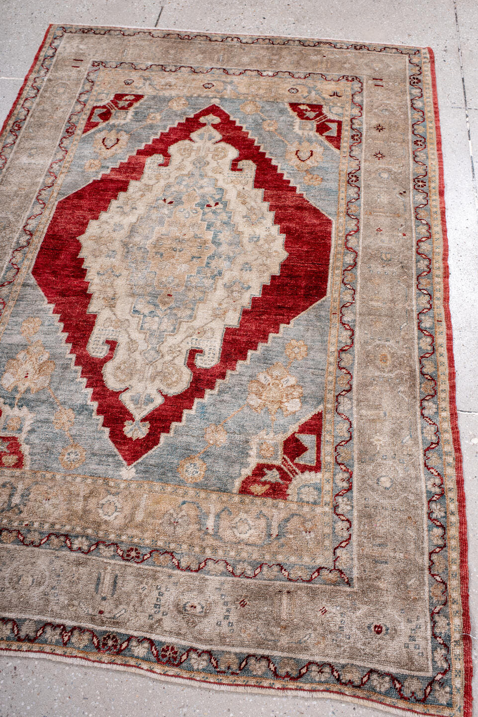 3' x 5' one-of-a-kind handmade antique Anatolian small size rug. Color palette: ivory, beige, pale blue, brick red, taupe