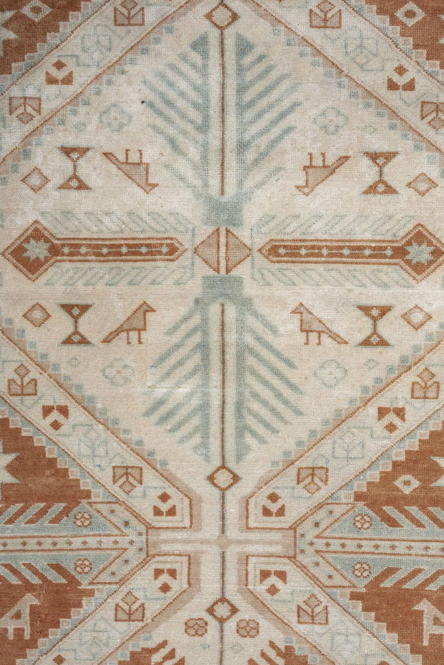 4' x 5' one-of-a-kind handmade antique Caucasian small size rug. Color palette: terra cotta, ivory, pale blue, camel, taupe