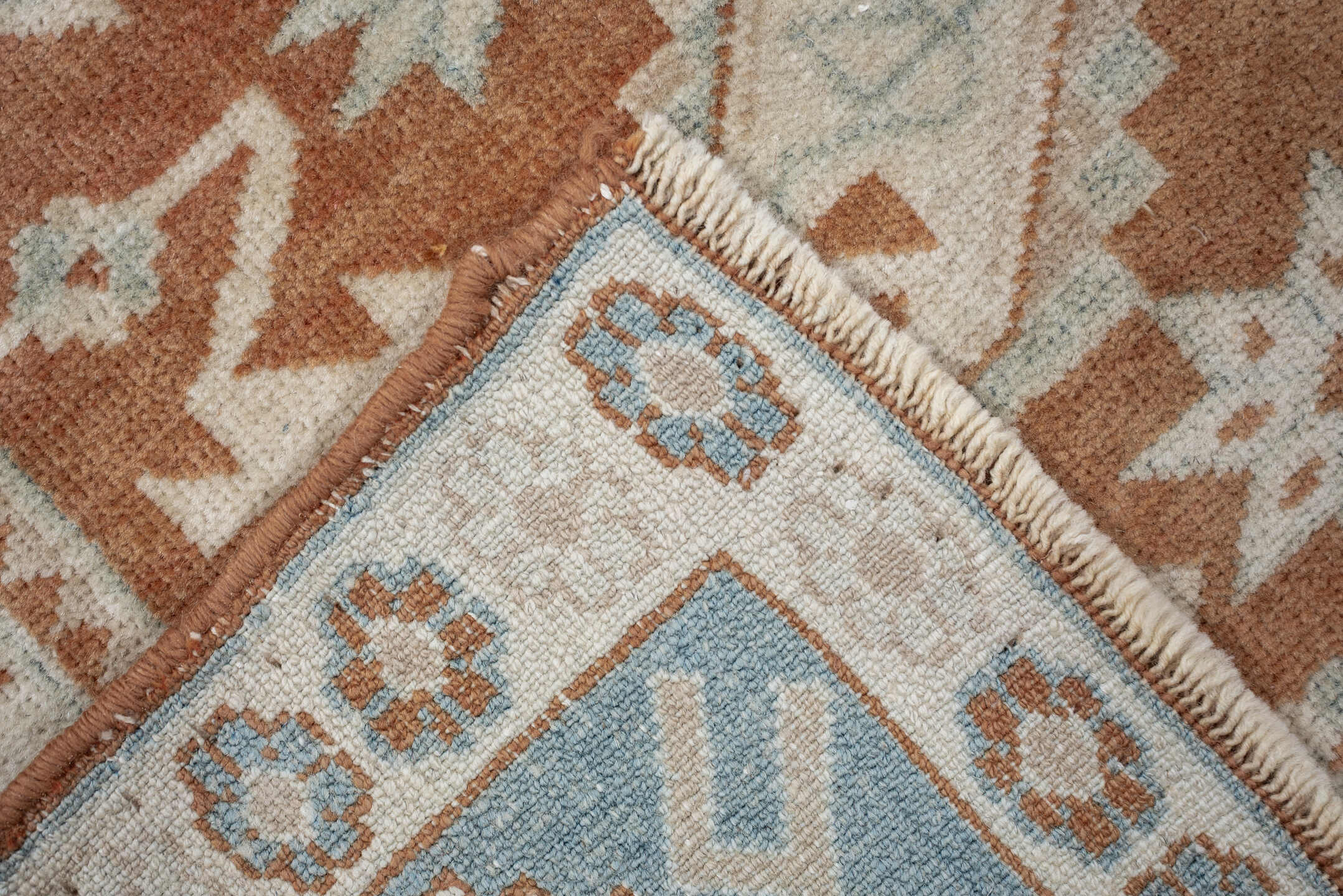 4' x 5' one-of-a-kind handmade antique Caucasian small size rug. Color palette: terra cotta, ivory, pale blue, camel, taupe