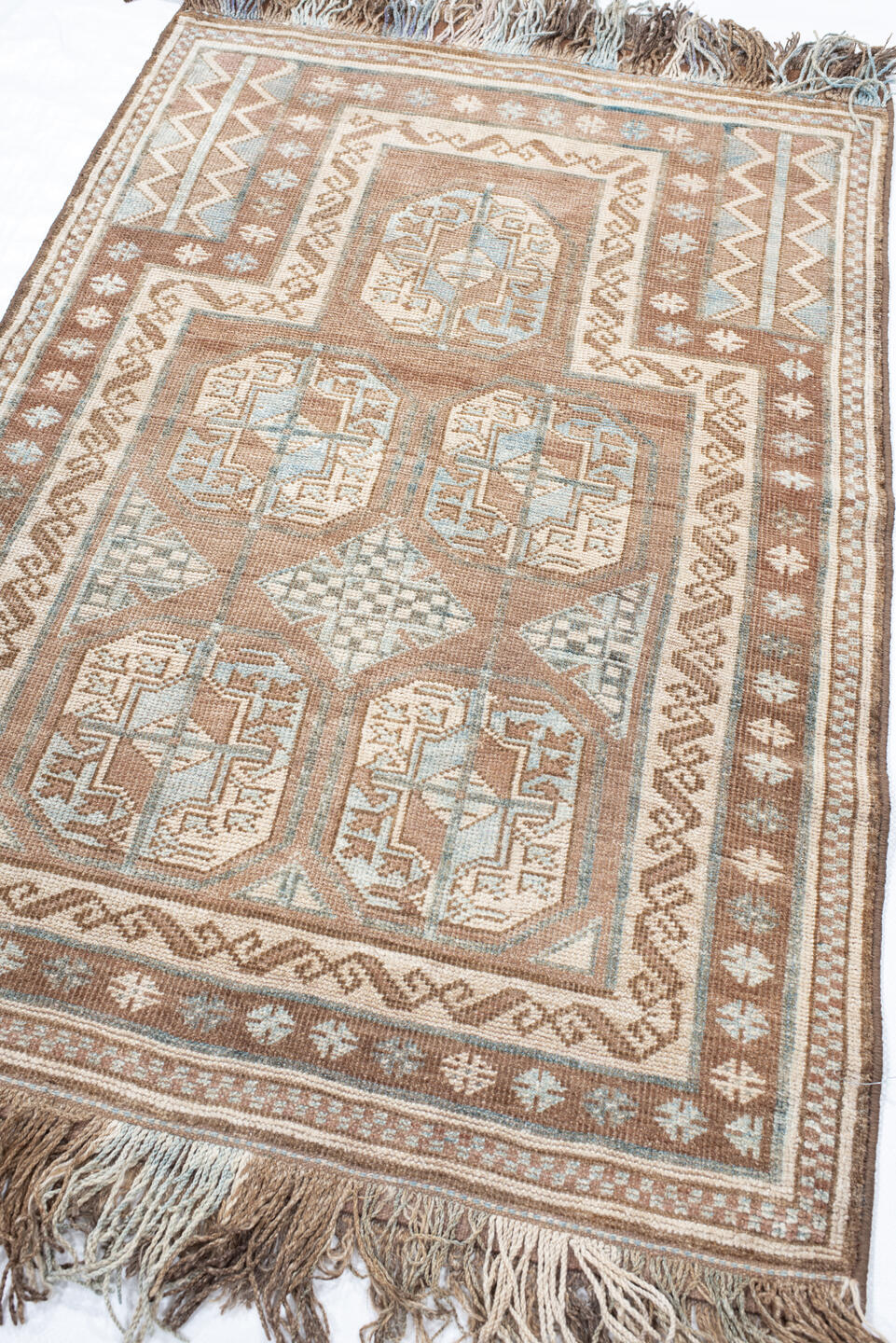 3' x 4' one-of-a-kind handmade vintage Belouch small size rug. Color palette: camel, ivory, pale blue, taupe, brown, beige