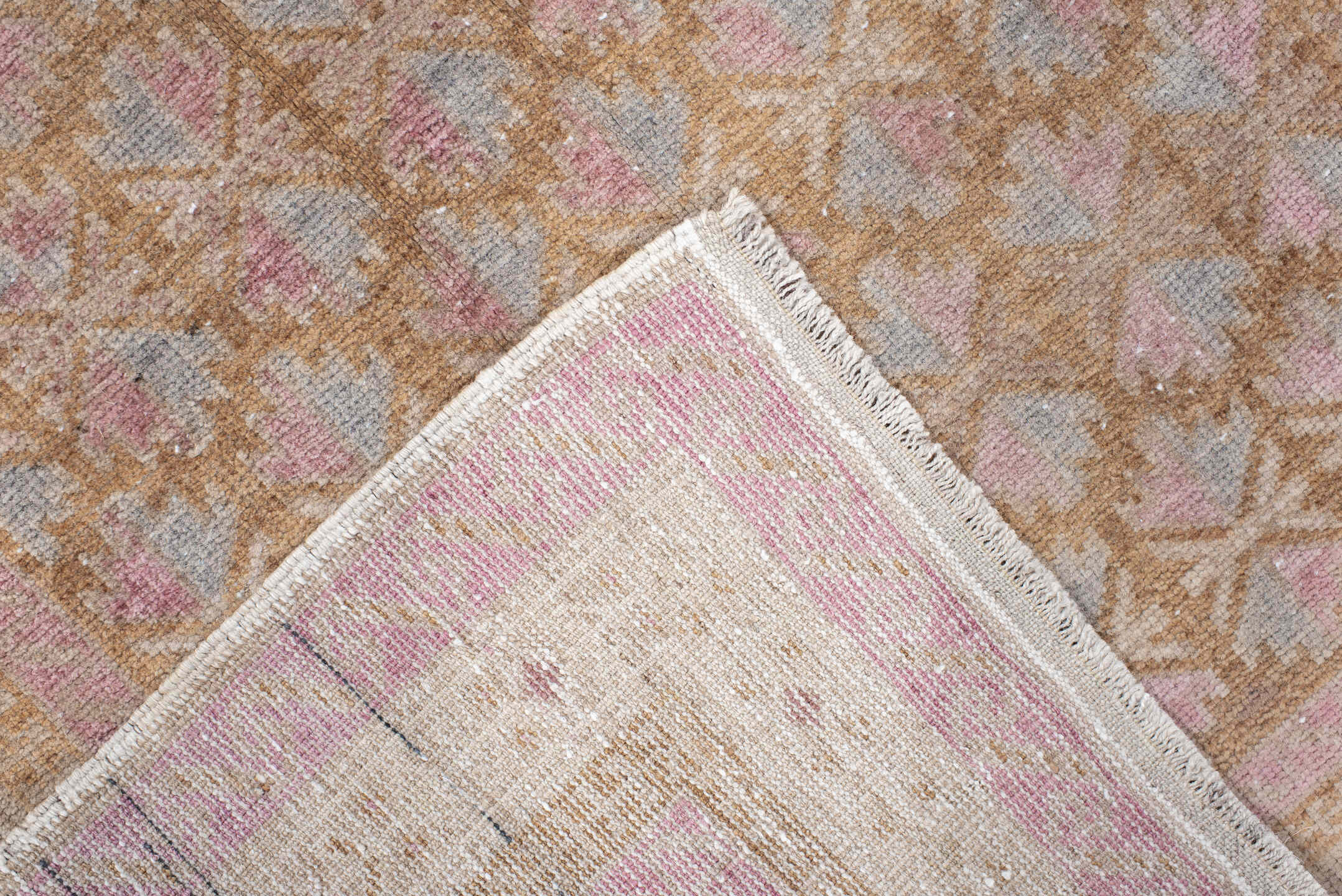 2' x 4' one-of-a-kind handmade vintage Belouch small size rug. Color palette: ivory, blush, camel, taupe, dusty rose