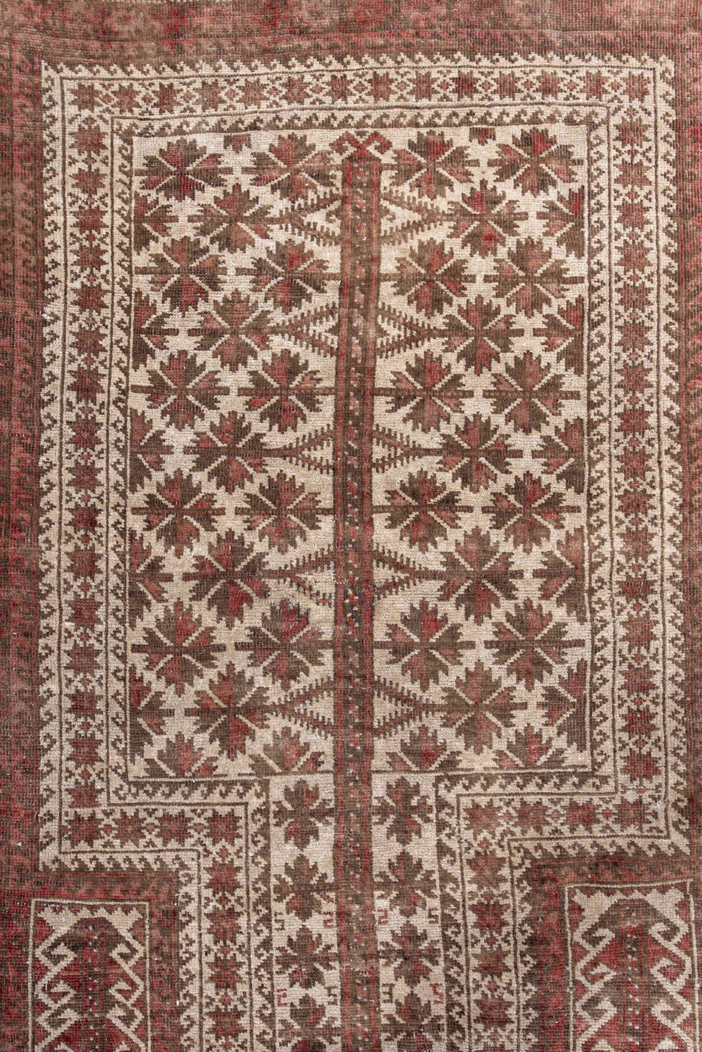 3' x 5' one-of-a-kind handmade antique Belouch small size rug. Color palette: rust, ivory, brown, burgundy, taupe, camel