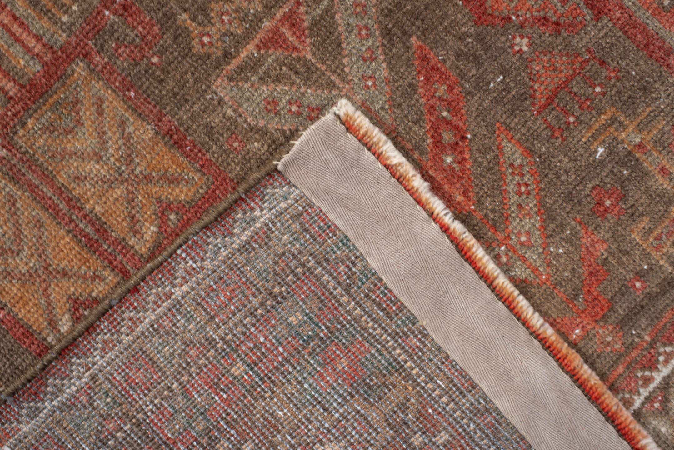 3' x 9' one-of-a-kind handmade antique Belouch runner rug. Color palette: taupe, rust, ivory, brown, terra cotta, camel
