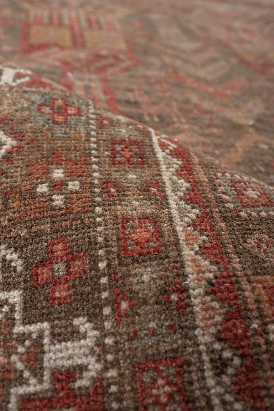 3' x 9' one-of-a-kind handmade antique Belouch runner rug. Color palette: taupe, rust, ivory, brown, terra cotta, camel