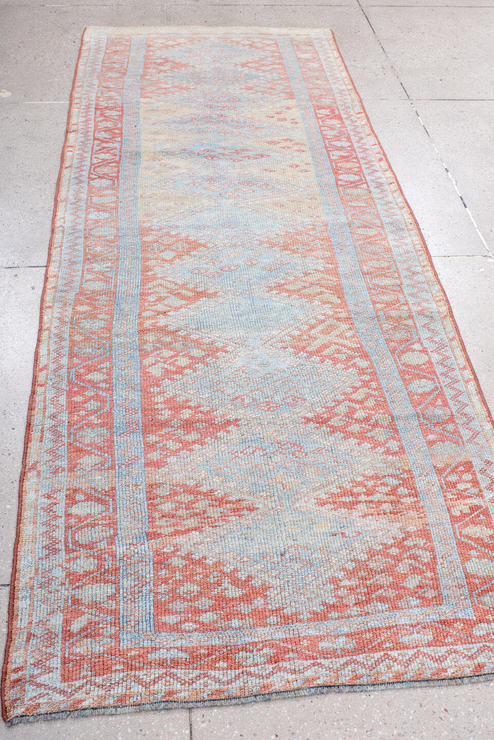 3' x 9' one-of-a-kind handmade antique Kurd runner rug. Color palette: ivory, sky blue, coral, rust, pale blue, salmon