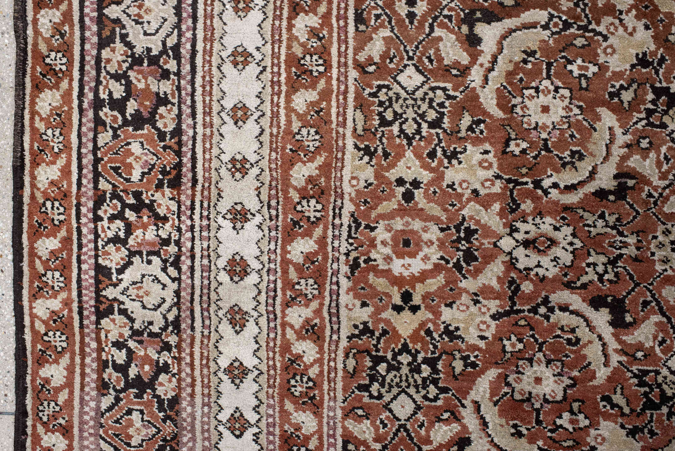 12' x 15' one-of-a-kind handmade antique Agra oversize rug. Color palette: terra cotta, ivory, charcoal, taupe, brown, camel