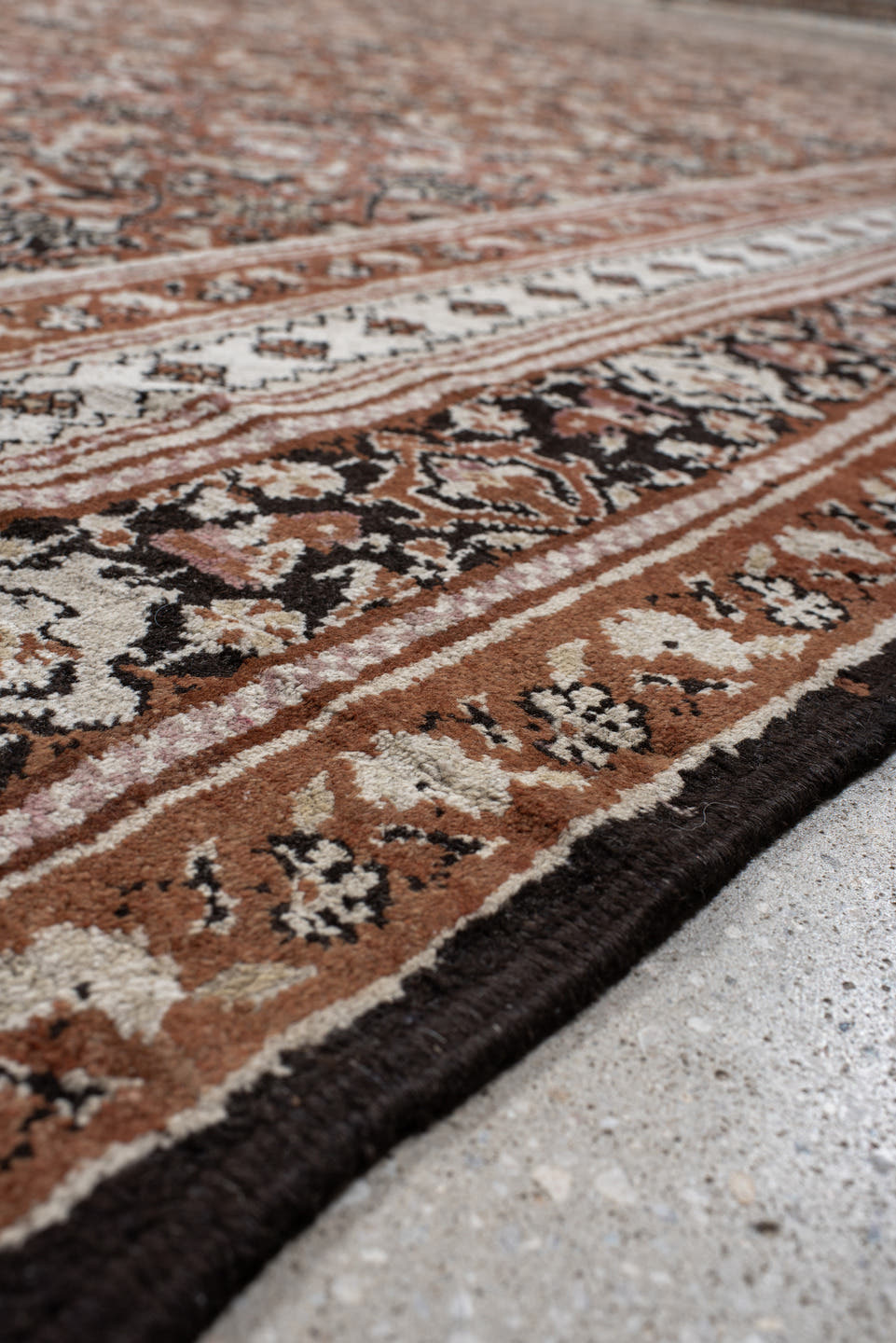 12' x 15' one-of-a-kind handmade antique Agra oversize rug. Color palette: terra cotta, ivory, charcoal, taupe, brown, camel