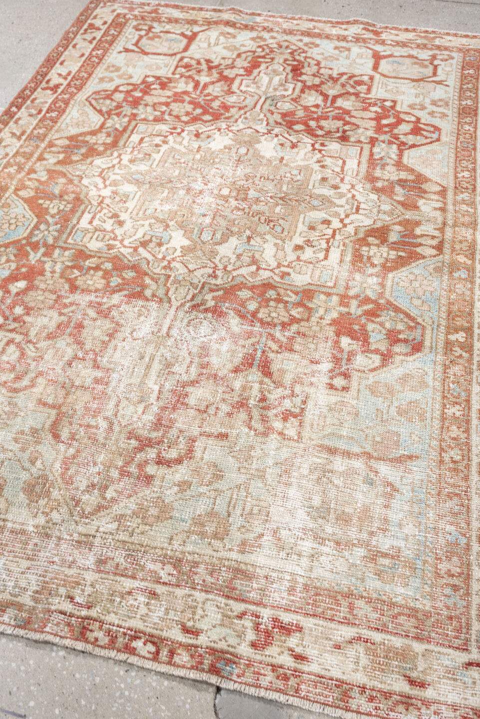 4' x 6' one-of-a-kind handmade antique Baktiary rug. Color palette: ivory, terracotta, pale blue, beige, taupe, camel, brown