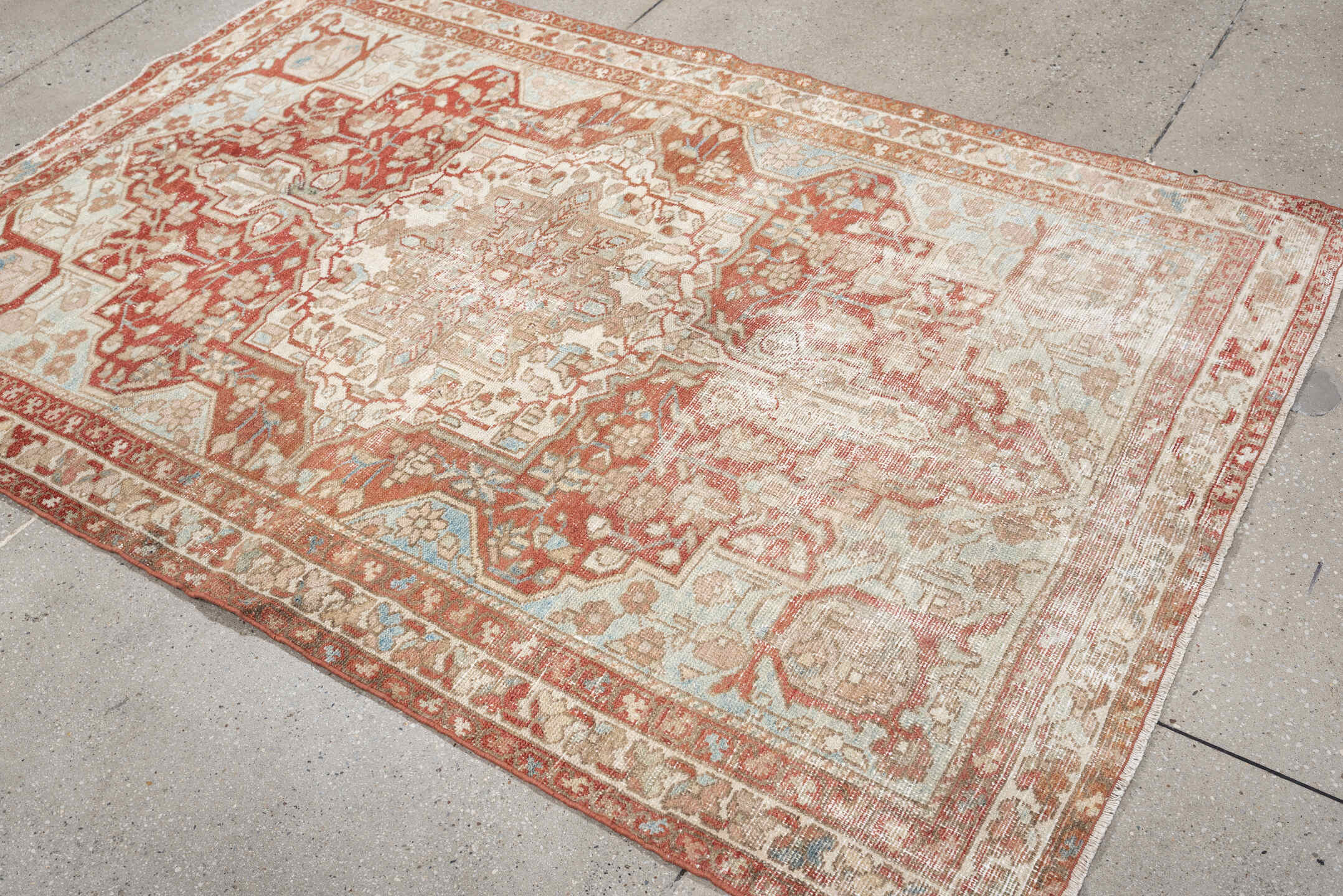 4' x 6' one-of-a-kind handmade antique Baktiary rug. Color palette: ivory, terracotta, pale blue, beige, taupe, camel, brown