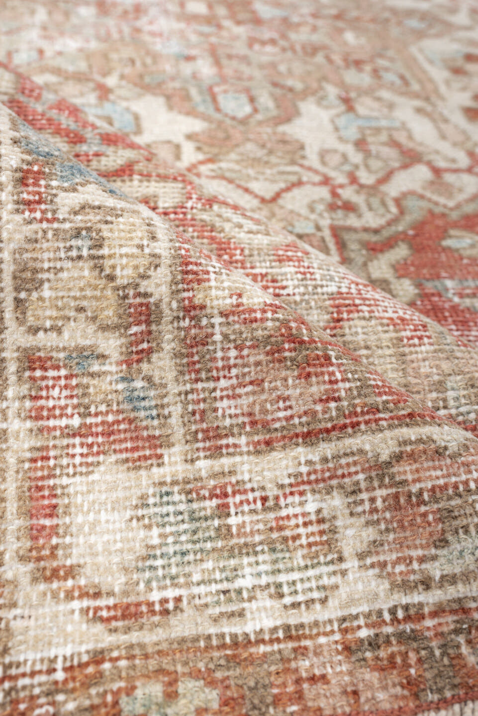 4' x 6' one-of-a-kind handmade antique Baktiary rug. Color palette: ivory, terracotta, pale blue, beige, taupe, camel, brown