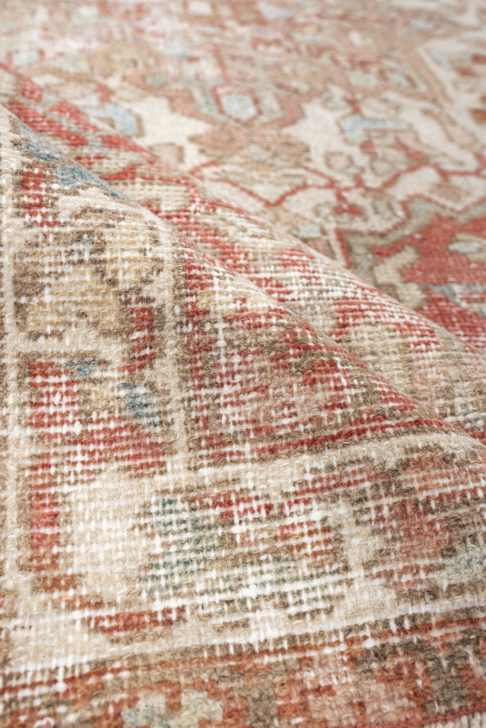 4' x 6' one-of-a-kind handmade antique Baktiary rug. Color palette: ivory, terracotta, pale blue, beige, taupe, camel, brown